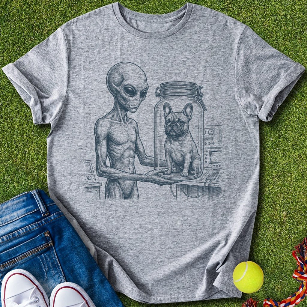 Gray t-shirt with alien holding a dog in a jar graphic on grass